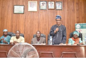 The University Vice-Chancellor, Professor Felix Kolawole Salako represented by the Bursar, Mr. Chukwuwnike Ezekpeazu (holding mic) making vital points while the Executives of ICAN, Abeokuta District listen with rapt attention at the ‘Village Square Meeting’