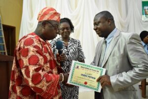 The University Registrar and Secretary to Council, Dr. ‘Bola Adekola (3rd Right) receiving his Grand Patron Award at USSA Workshop