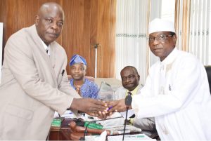 (R-L) Pro-Chancellor, Dr. (Barr.) Aboki Zhawa presenting an award plaque to the Out-gone representative of the Federal Ministry of Agriculture and Rural Development on Council, Dr. Olumuyiwa Akinsola, while the Vice-Chancellor Prof. Kolawole Salako and Deputy Vice-Chancellor (Development), Prof. Lateef Sanni watches