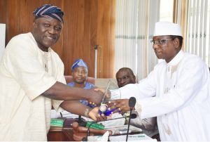 (R – L) Chairman of Council and Pro-Chancellor, Dr. (Barr.)Aboki Zhawa presenting a plaque of award to the Out-gone representative of Senate on Council and Dean, Post-graduate School, Professor Wilfred Alegbeleye