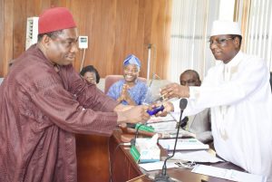 (R–L) Chairman of Council and Pro-Chancellor, Dr.(Barr.) Aboki Zhawa presenting a plaque of award to the Out-gone representative of Senate on Council, Professor Christain Ikeobi