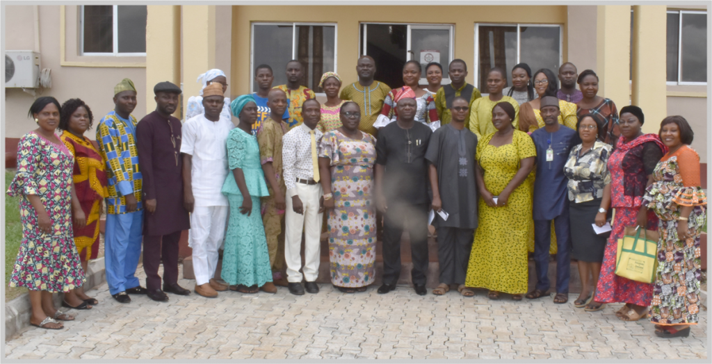 The Registrar of the University, Dr. ‘Bola Adekola (7th Right) in a group photograph with top officials of the University and cadres of Registry staff after the Training