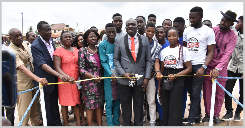 The Vice-Chancellor, Professor KolawoleSalako flanked by Principal Officers, Directors and Student Union Executives cutting the tape of the new Car Park.