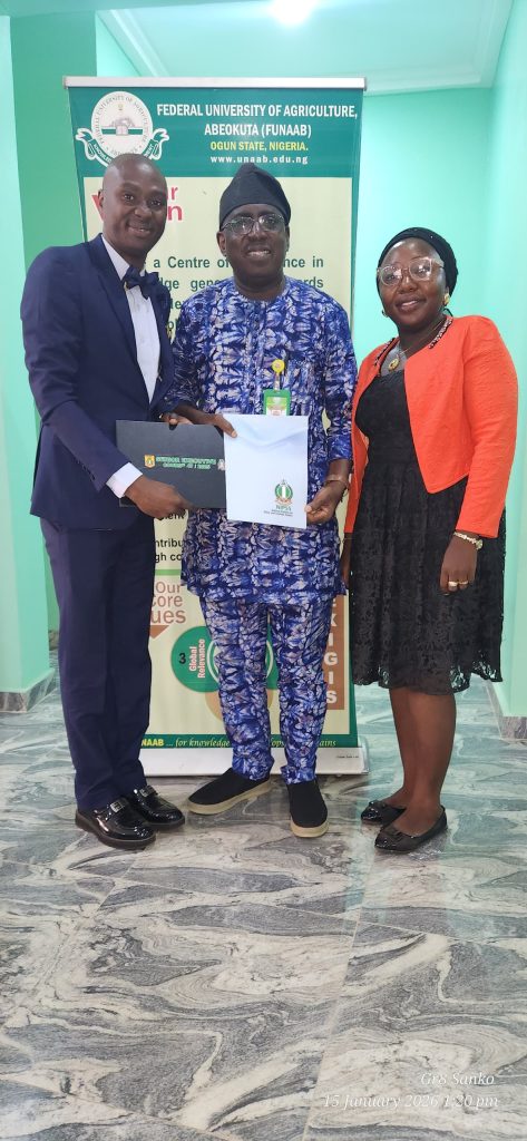 The Vice-Chancellor, Prof. Babatunde Kehinde displaying the NIPSS certificates with Dr. Kazeem Akande and his wife, Ambassador (Mrs.) Muibat Akande Credit: Olasunkanmi Olajide