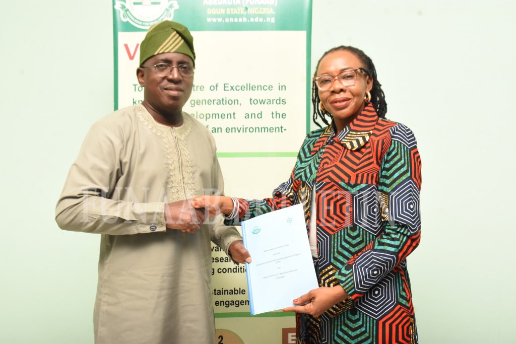The Vice-Chancellor, Prof. Babatunde Kehinde, receiving the signed MoU from the representative of the President of CIPM and the Vice President of the Institute, Mrs. Chidinma Obiejesi, after both parties had signed it Credit: Gbolahan Lawal
