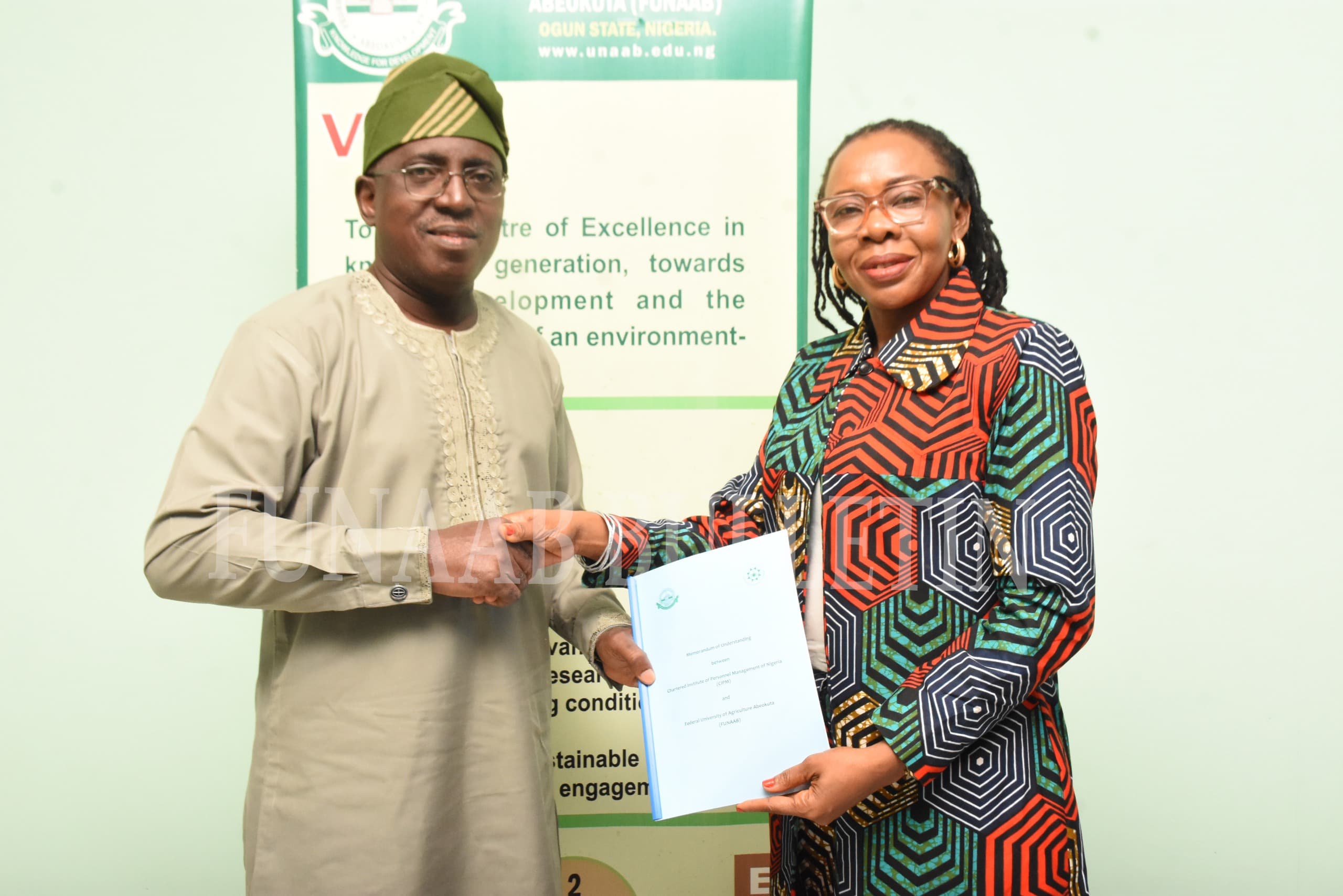 The Vice-Chancellor, Prof. Babatunde Kehinde, receiving the signed MoU from the representative of the President of CIPM and the Vice President of the Institute, Mrs. Chidinma Obiejesi, after both parties had signed it Credit: Gbolahan Lawal